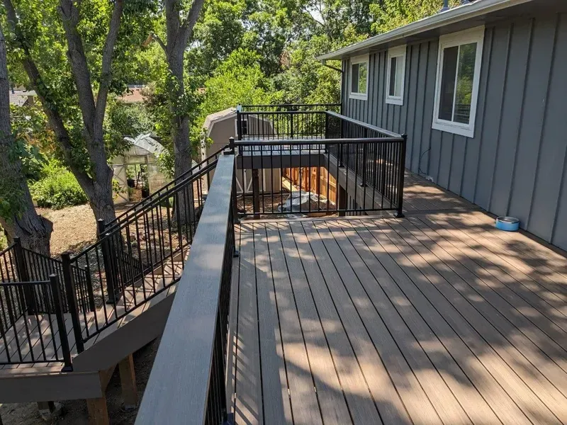 Composite deck walkway with black railing