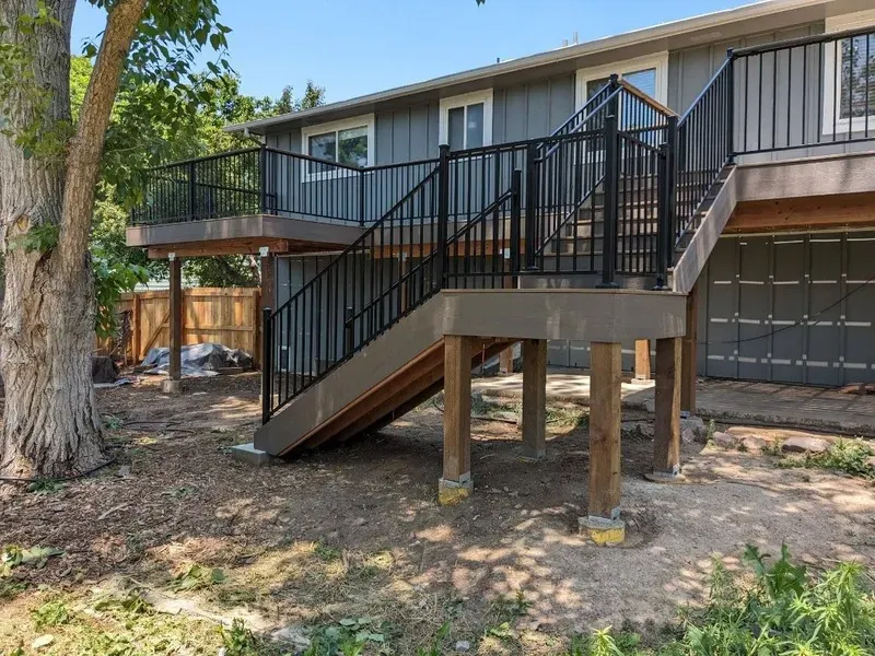 Elevated composite deck with stairs and railing