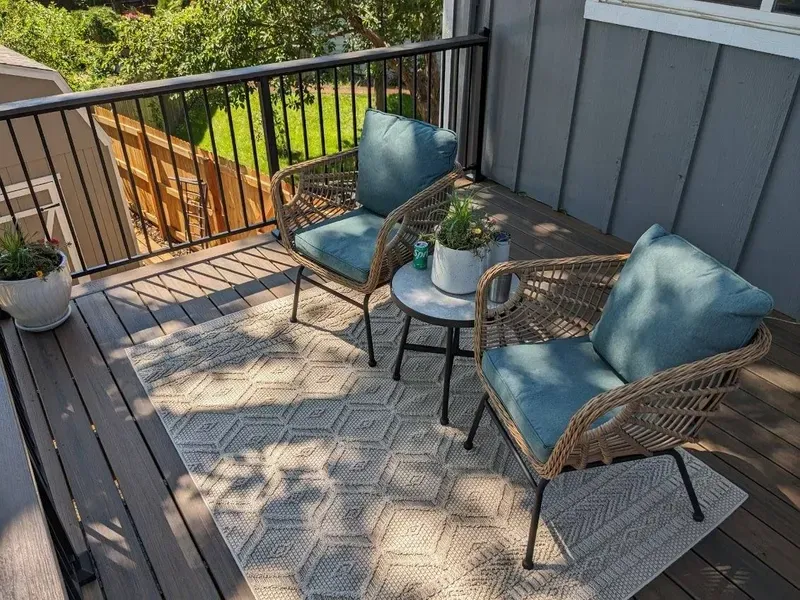 Composite deck seating area with railing