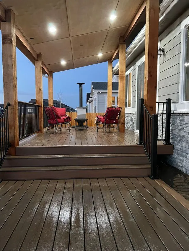 Covered composite deck with lighting and railing