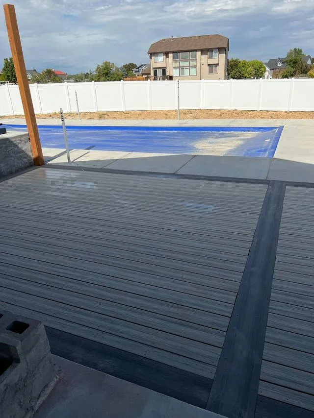 Composite poolside deck with railing