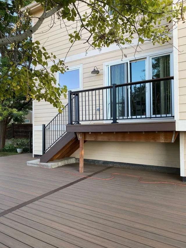 Composite deck balcony with staircase